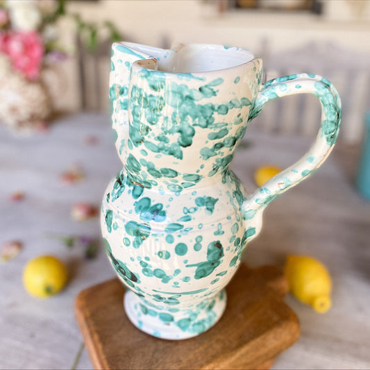green splatterware jug for water or flowers