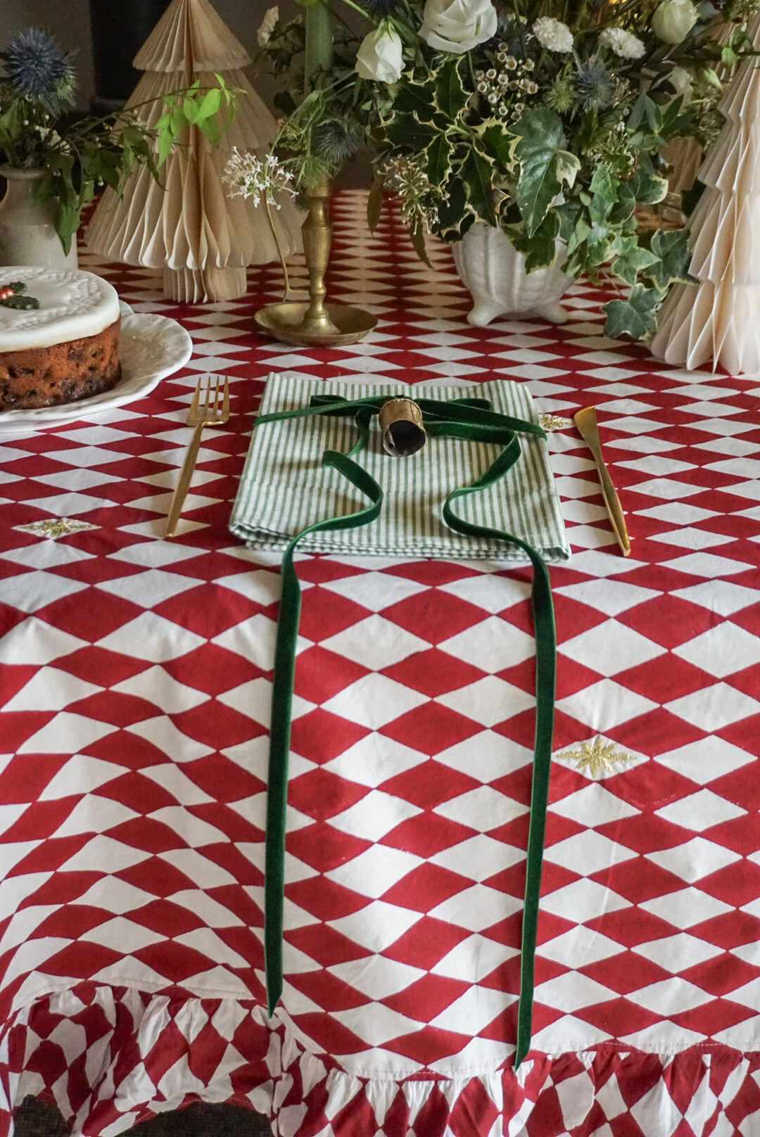 Berry red tablecloth with embroidered stars for festive table
